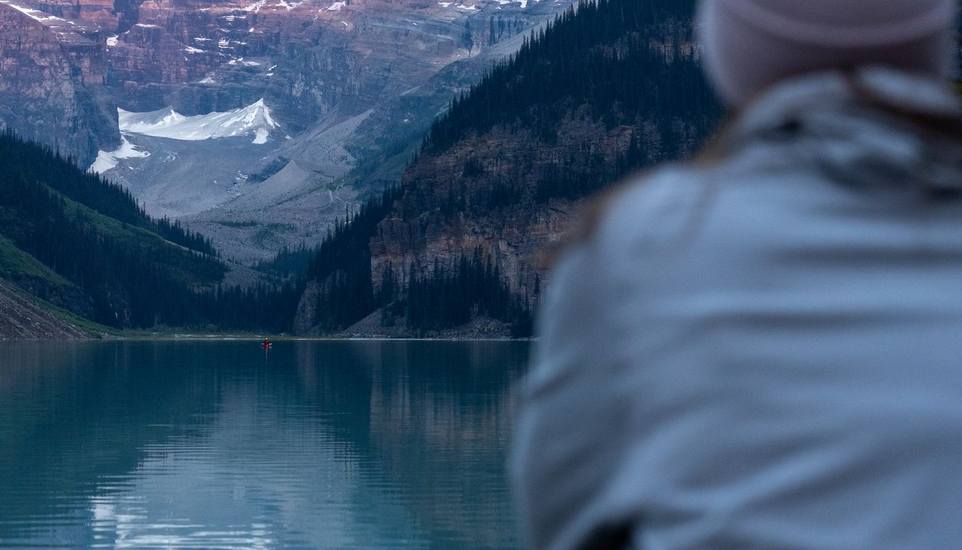 Guide setting up a sunrise viewpoint above Lake Louise for private guests