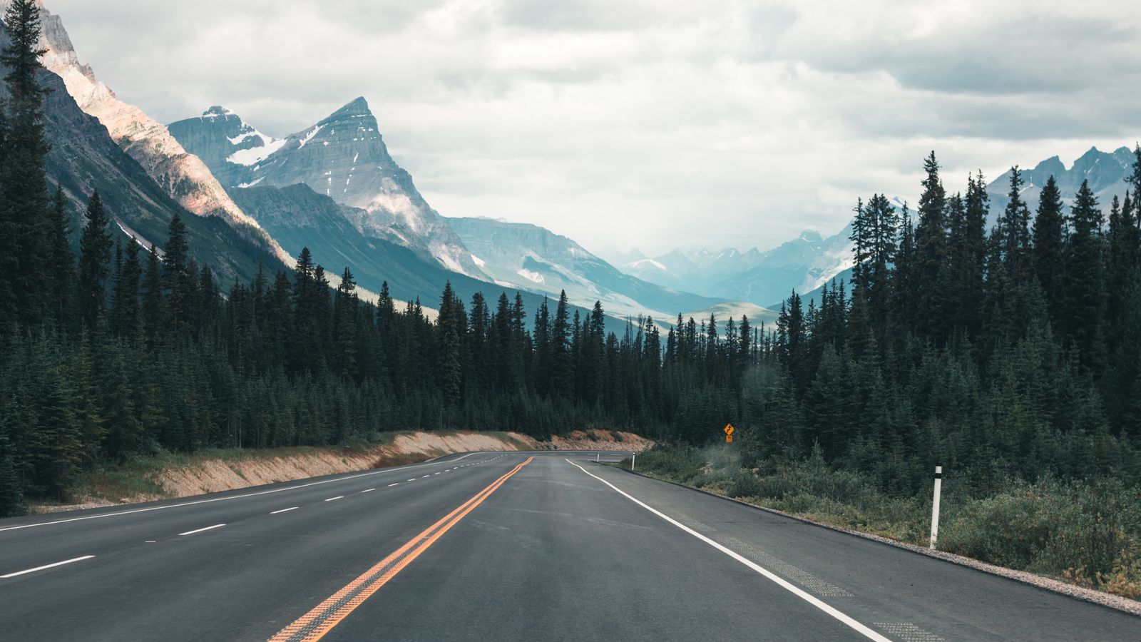 Private Canada tours: a quiet highway through the Canadian Rockies at first light