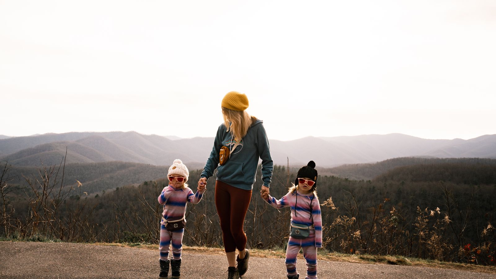 Luxury family tour Canada: parents and children on a guided lakeside walk in the Canadian Rockies