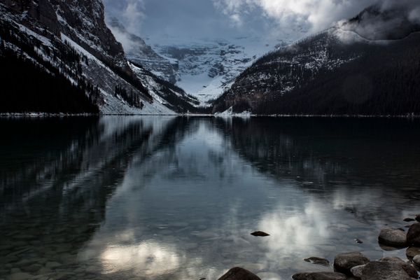 Mountain weather changing over a lake in the Canadian Rockies