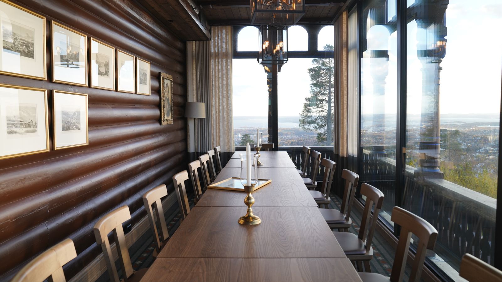 Evening light on a private mountain lodge terrace set for a corporate dinner