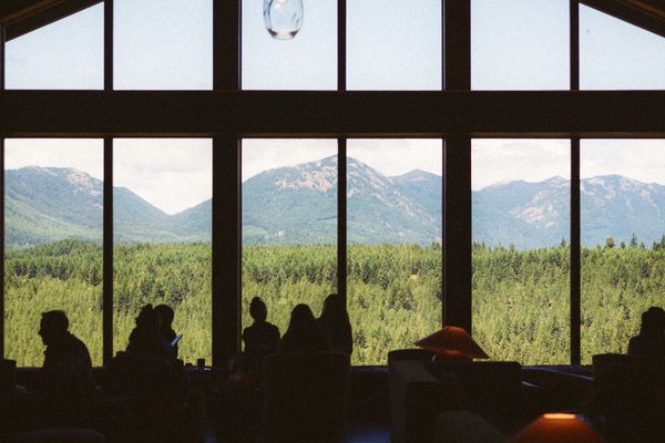 Strategy session in a lodge with mountain views behind