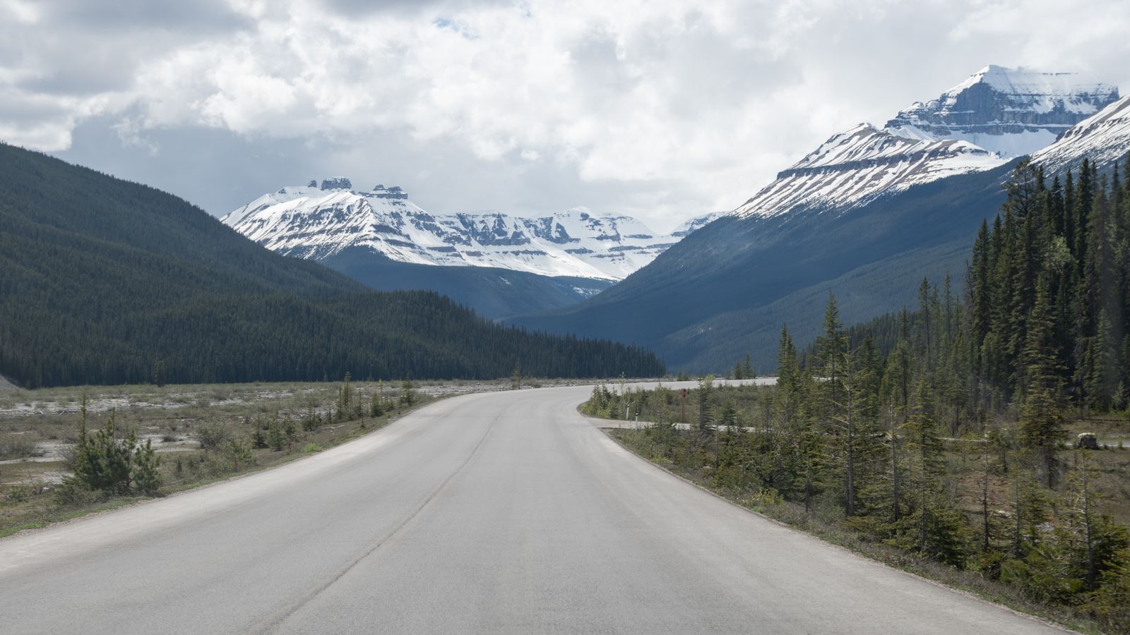 Private tours Canada: an empty mountain road at dawn on a luxury Canada journey