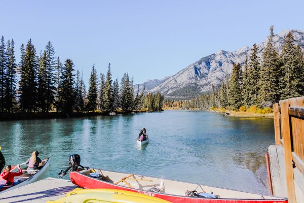 Canoe on a Rockies lake at dawn