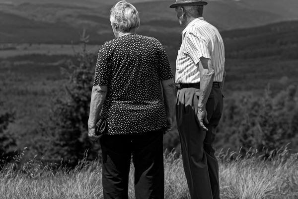 Retiree couple on the Icefields Parkway with a private vehicle and guide