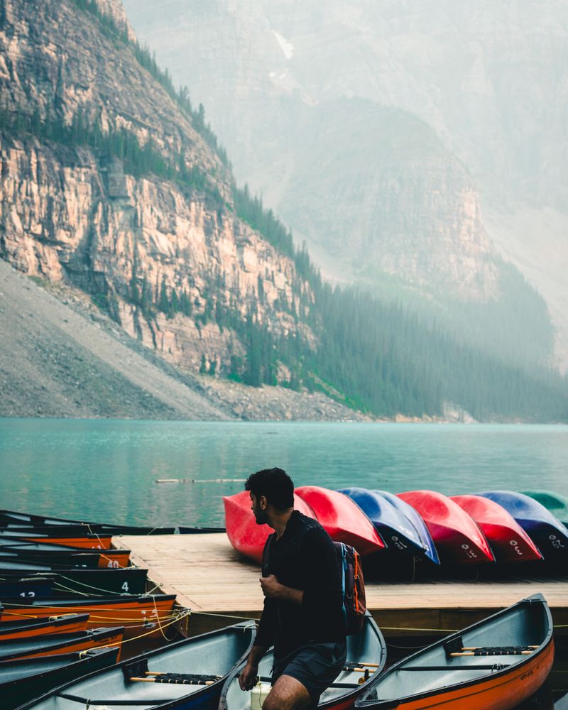 Canoe on a still Rockies lake in Jasper National Park