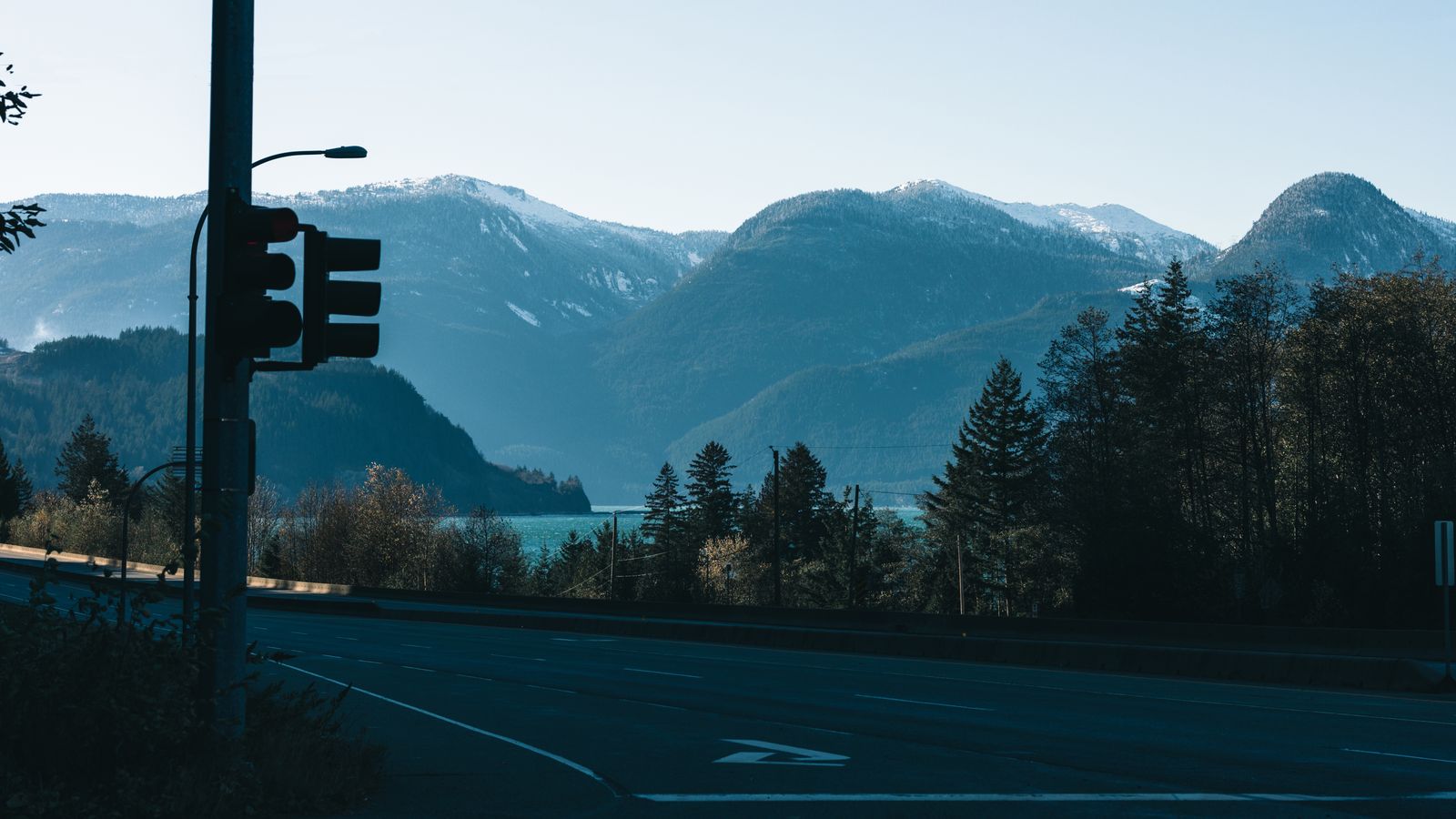 Journal of private Canada travel guides: a mountain road and a notebook at first light