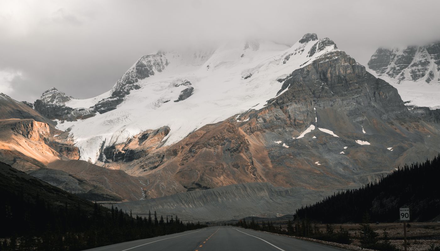 The road south from Jasper with early light on the peaks