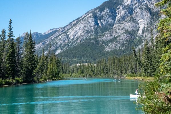 Canoe on a still lake in Jasper National Park at dawn