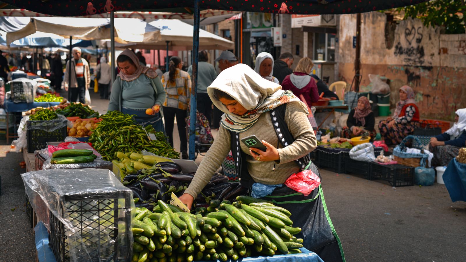 Morning shoppers in Centennial Park with the market at full swing