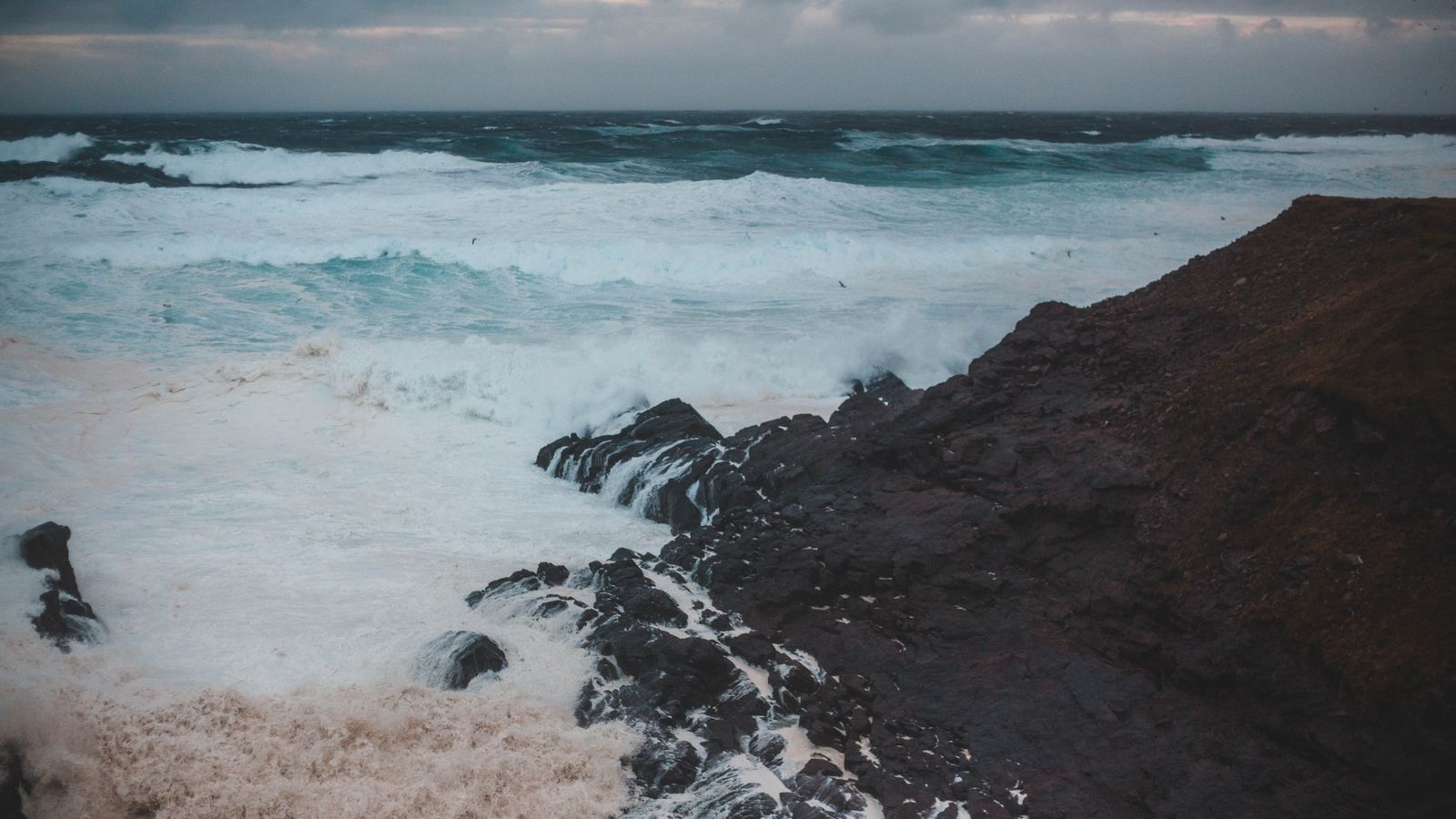 Storm light on the Tofino shoreline at dusk